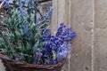 Handifraft artificial violet and purple flowers in wicker basket