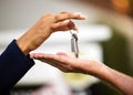 Handing over the keys is the last thing to do. an unrecognizable female real estate agent handing the keys of a newly Royalty Free Stock Photo