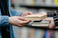 Handing Over a Stack of Books.