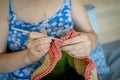 Handiwork. Knitting. Handmade. A girl crochets a colored bag Royalty Free Stock Photo