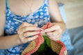 Handiwork. Knitting. Handmade. A girl crochets a colored bag Royalty Free Stock Photo