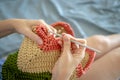 Handiwork. Knitting. Handmade. A girl crochets a colored bag Royalty Free Stock Photo