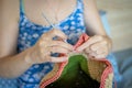 Handiwork. Knitting. Handmade. A girl crochets a colored bag Royalty Free Stock Photo