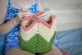 Handiwork. Knitting. Handmade. A girl crochets a colored bag Royalty Free Stock Photo