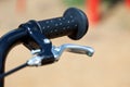 Handle of a bike with the brake lever Royalty Free Stock Photo