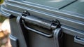 The handle is designed for easy carrying with a comfortable grip and a secure locking mechanism. You can easily