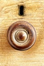 Handle on a drawer with keyhole escutcheon above.