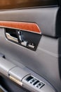 Handle and electric seat buttons of luxury modern car