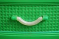 handle on a green plastic kitchen cabinet Royalty Free Stock Photo
