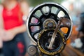 Handle, hand drive and flywheel of an antique sewing machine Royalty Free Stock Photo