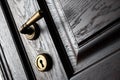 Handle and keyhole on a wooden door in beautiful lighting