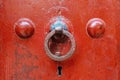 Handle ring on an old red painted door Royalty Free Stock Photo