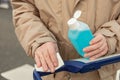 The handle of a shopping cart get disinfected