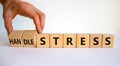 Handle stress symbol. Businessman turns cubes and changes words `stress` to `handle stress`. Beautiful white background. Medic