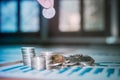 Handles coins placed on a pile of money on the table with light Sunset`s business concept Royalty Free Stock Photo