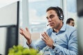 Handling calls with the utmost professionalism. a young call centre agent working in an office. Royalty Free Stock Photo