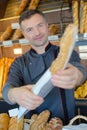he handling over baguette Royalty Free Stock Photo