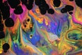 Abstract acrylic pour painting of vibrant neon flames. Royalty Free Stock Photo