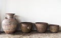 Handmade antique pottery by a wall