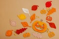 Handmade autumn background. Set of different fall knitted and crocheted fall leaves and wooden pumpkins Royalty Free Stock Photo