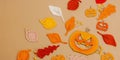 Handmade autumn background. Set of different fall knitted and crocheted fall leaves and wooden pumpkins Royalty Free Stock Photo