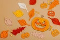 Handmade autumn background. Set of different fall knitted and crocheted fall leaves and wooden pumpkins Royalty Free Stock Photo