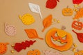 Handmade autumn background. Set of different fall knitted and crocheted fall leaves and wooden pumpkins Royalty Free Stock Photo