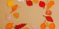 Handmade autumn background. Set of different fall knitted and crocheted fall leaves and wooden pumpkins Royalty Free Stock Photo