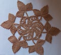 Handmade beige circular crochet doily
