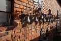 Handmade bells placed on the brick wall of the house Royalty Free Stock Photo