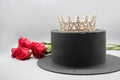 Handmade black cake with a crown