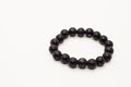 Handmade black onix bracelet on a white background Royalty Free Stock Photo