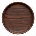 Handmade black walnut round wood plate. Walnut round wooden tray. Black walnut wood plank texture background.