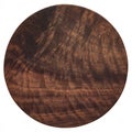 Handmade black walnut round wooden chopping board. Walnut round wooden pallet. Black walnut wood plank texture background.