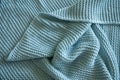 Handmade blue knitted wool blanket, texture background