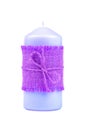 handmade blue romantic candle tied with purple canvas isolated on a white background Royalty Free Stock Photo