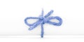Handmade blue string node tied on white paper tube isolated Royalty Free Stock Photo