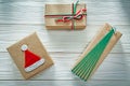 Handmade boxed Christmas gifts on wooden board holidays concept