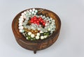 Handmade bracelets in a wooden bowl on an isolated white Royalty Free Stock Photo