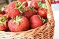 Handmade braided wicker basket with strawberries