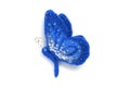 Handmade brooch from felt in the form of a blue butterfly, decorated with beads on a white background Royalty Free Stock Photo