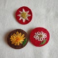 Handmade brooches embroidered with spring flowers Royalty Free Stock Photo