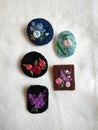Handmade brooches embroidered with spring flowers Royalty Free Stock Photo
