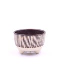 Handmade brown flower ceramic pot on white background