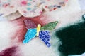 Handmade butterfly on the colorful fabric