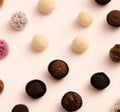 Handmade candies with different fillings lie on a light background top view.