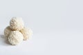 Handmade candies. Sweet balls, white Chocolate candies with coconut crumb on white isolated background. Copy space in right side. Royalty Free Stock Photo