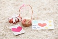 Handmade cards, basket with flowers and gift box on carpet. Mother's day celebration Royalty Free Stock Photo