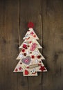 Handmade and carved christmas tree on dark brown wooden backgrou Royalty Free Stock Photo