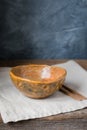 Handmade ceramic bowl on a wooden background, wabi sabi style Royalty Free Stock Photo